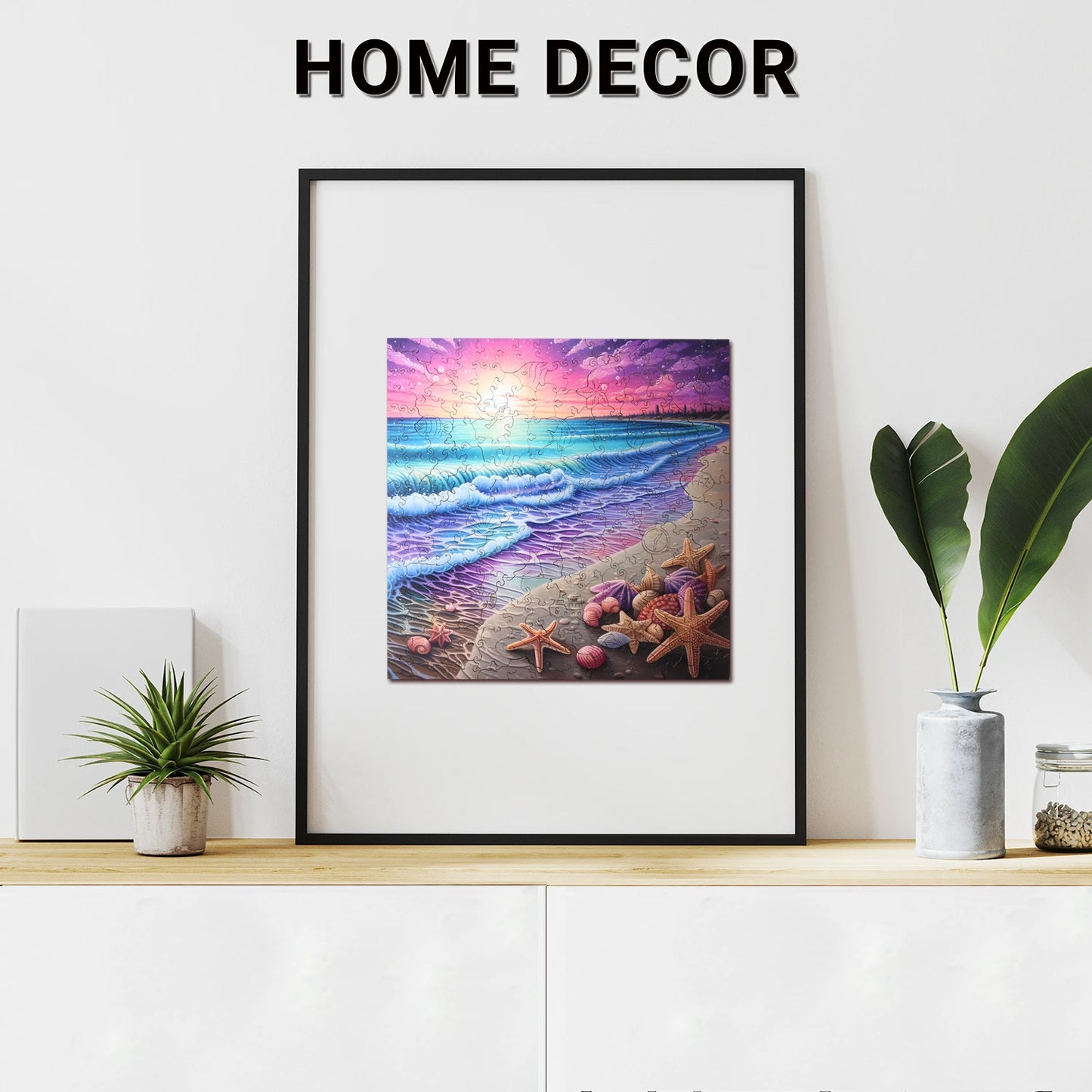 A 200-piece benlarkytoys Wooden Puzzles Beach Starfish Sea Sunset jigsaw sits on a white cabinet, surrounded by potted plants and stress relief games, beneath a Home Decor sign on a plain wall.