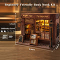 A wooden book nook DIY model kit labeled 'The cheese book' with warm interior lighting, shown on a wooden tabletop with overlaid size and difficulty information. This is a product listing image rather than a pure instruction diagram because the main focus is still the assembled product, with only auxiliary text overlays.