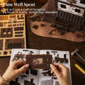 Hands assembling the benlarkytoys Western Sheriff’s Office 3D Wooden Puzzle – a DIY Book Nook Kit with LED Light. Instruction manual, tools, and kit pieces are spread out on the table. Text reads: Time Well Spent. This isn’t just a puzzle—it’s hours of relaxing, screen-free enjoyment as you craft your own mini Wild West sheriff’s office.